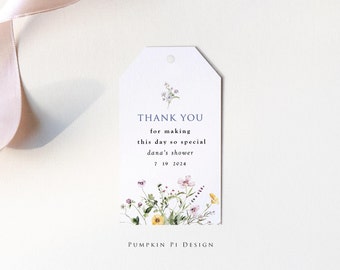 May include: A white thank you tag with a floral design and the text "THANK YOU for making this day so special dana's shower 7 19 2024 PUMPKIN PI DESIGN".