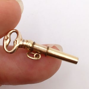 Antique, gold cased, pocket watch key, fob pendant.