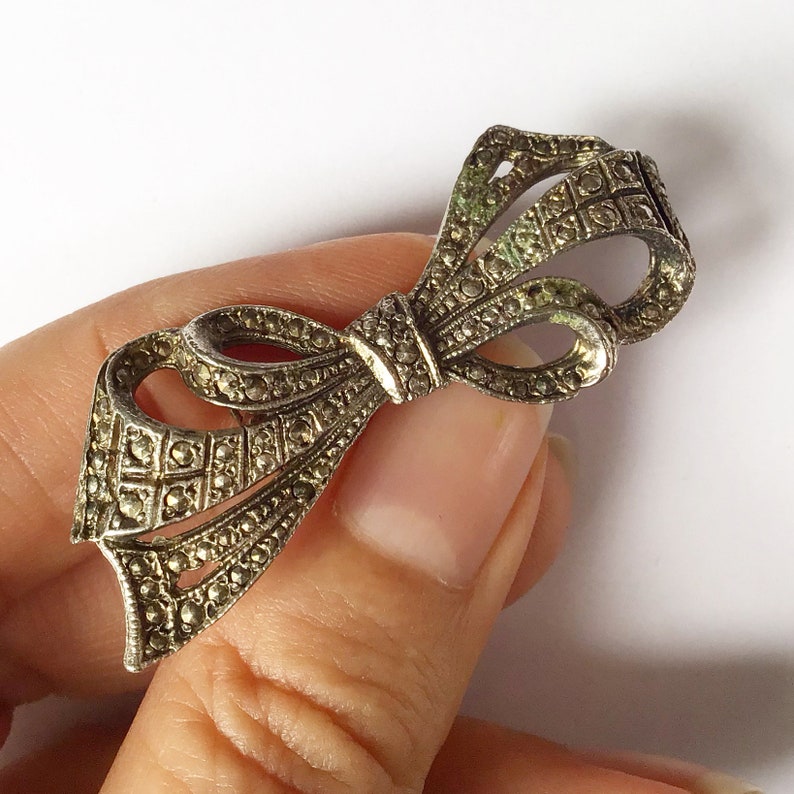 Vintage mid century faux marcasite bow brooch.
