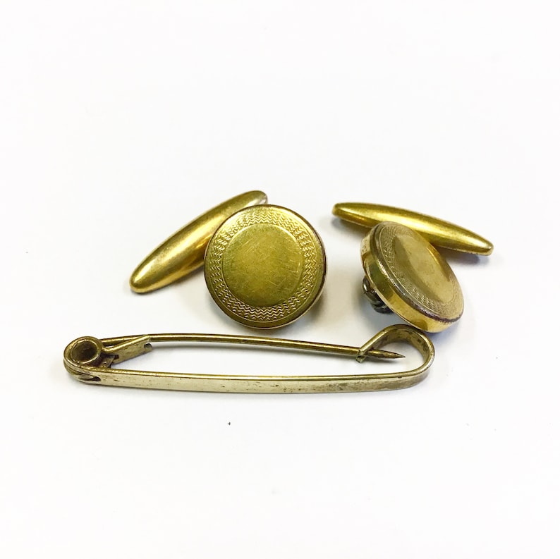 Vintage Art Deco rolled gold cufflinks with expanding and retracting chain mechanism and collar bar. engine turned