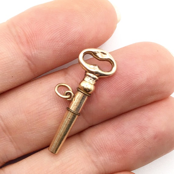Antique, gold cased, pocket watch key, fob pendant. Gem