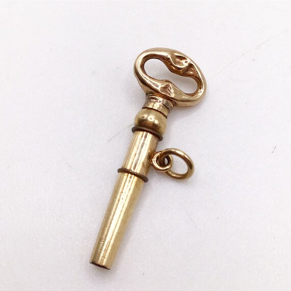 Antique, gold cased, pocket watch key, fob pendant. Gem