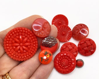 Collection of vintage buttons in red glass.