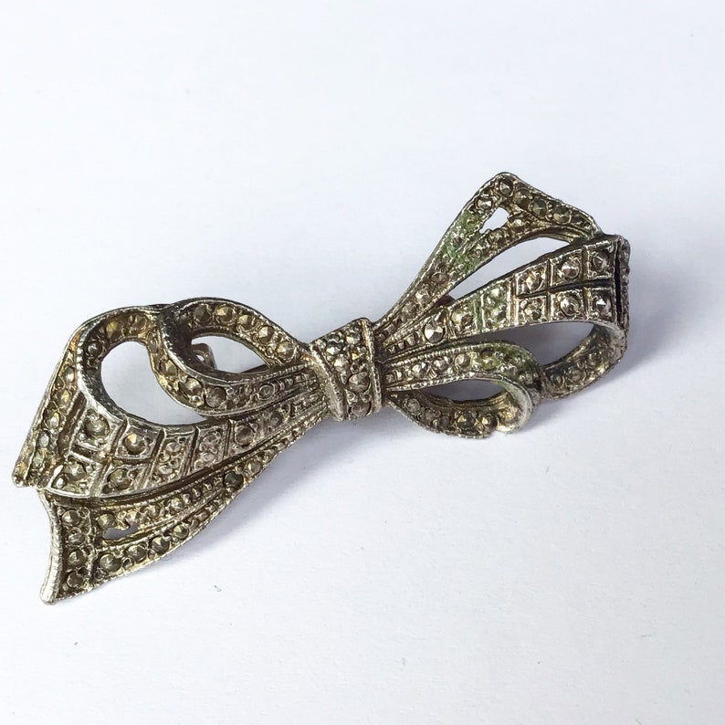 Vintage mid century faux marcasite bow brooch.
