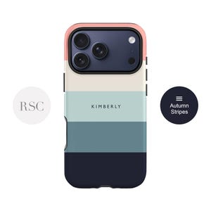 a colorful phone case with a gradient design, including shades of blue, pink, and gray. The case has a camera lens on the back and the name "KIMBERLY" printed on it.