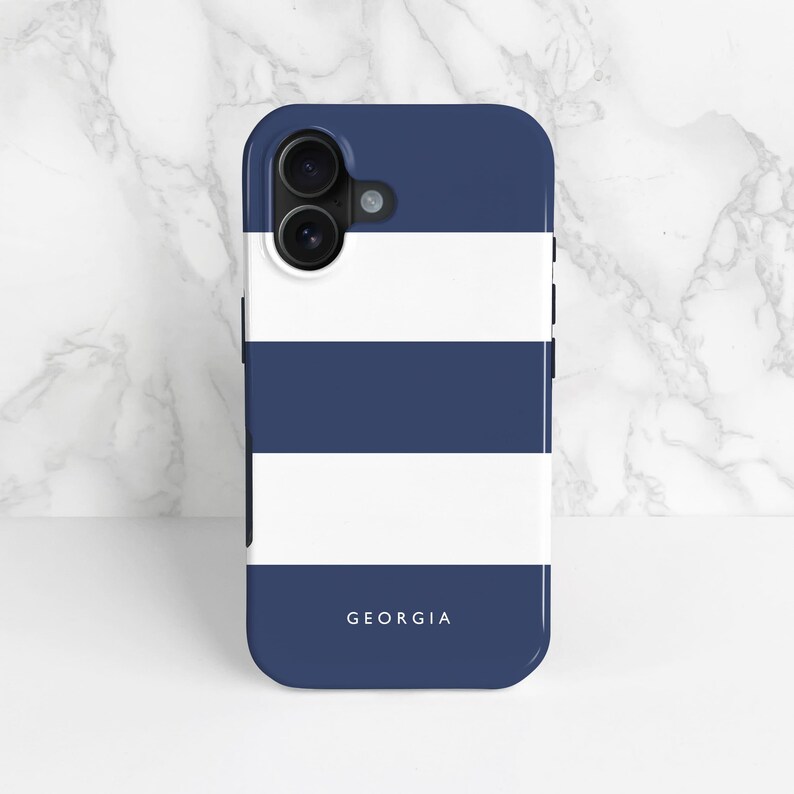 navy blue and white stripe phone case with a a personalised name and heart icon, shown on an phone 16 as an example