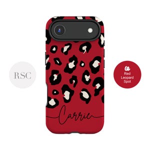 May include: A red phone case with a black and white leopard print design. The case has the name "Carrie" in a cursive font. The words "Red Leopard Spot" are on a red circle.