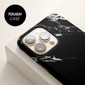 a black and white iphone case with three buttons