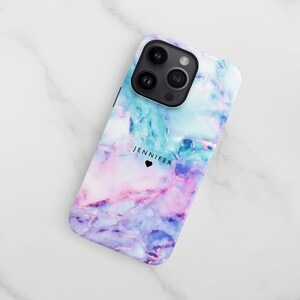 a phone case sitting on top of a marble surface