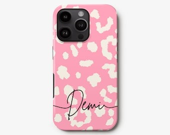 May include: A pink phone case with a white leopard print design and the name "Demi" written in black script.