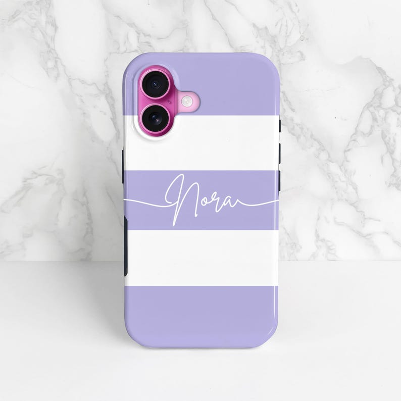 purple and white stripes phone case with a personalised cursive name, shown on an iPhone as an example and stood up against a marble background