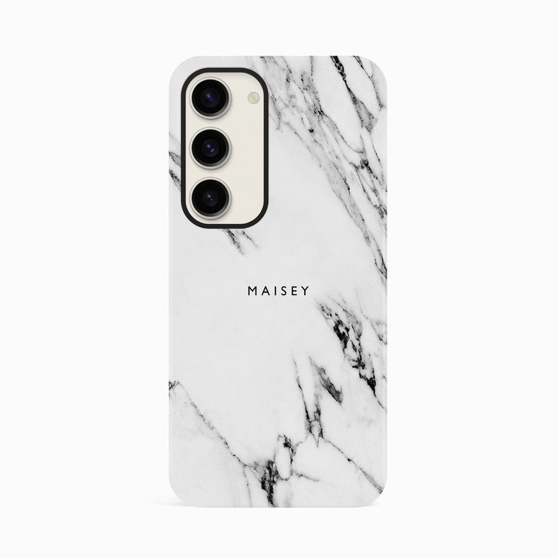 a white marble phone case with the name maisey on it