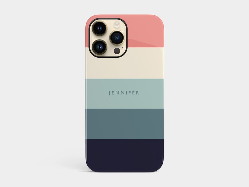 May include: A phone case with a striped design in shades of pink, cream, blue, and navy. The case has the name "JENNIFER" printed on it.