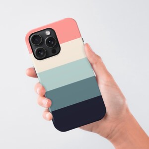 a person holding a phone case in their hand