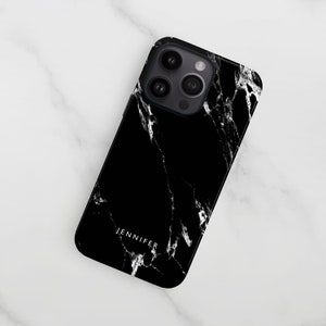 a black and white iphone case on a marble surface
