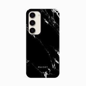 a black marble phone case with the name maisey on it