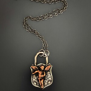 Angel Symbolism Necklace - Lock Pendant with Guardian Angel Charm.