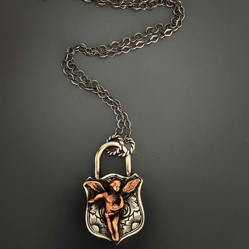 Angel Symbolism Necklace - Lock Pendant with Guardian Angel Charm.
