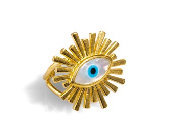 May include: Gold ring with a white and blue evil eye charm surrounded by gold rays.