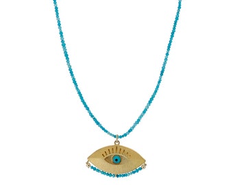 Colgante de oro con ojo turco y pequeña piedra turquesa con cuentas. Collar con mensaje positivo.