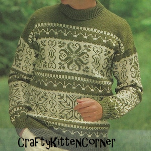 May include: A green and white knitted jumper with a snowflake pattern. The jumper has a crew neck and long sleeves.