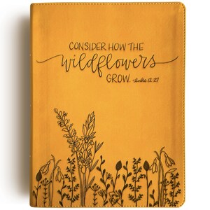 May include: A yellow leather-bound journal with the text "CONSIDER HOW THE WILDFLOWERS GROW. -Luke 12:27" and a floral design.