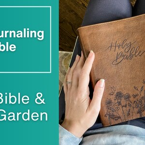 A New International Version Journaling by Zondervan Publishing in Tan. It has a design of Grass and Flowers engraved on it. It is hand lettered with calligraphy and makes a beautiful Christian gift, Gods Word, Scripture, 9780310455271