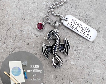 May include: Silver dragon cremation necklace with a red gemstone and a personalized tag that reads "Michelle 1963-2021". The necklace comes with a free urn filling kit.