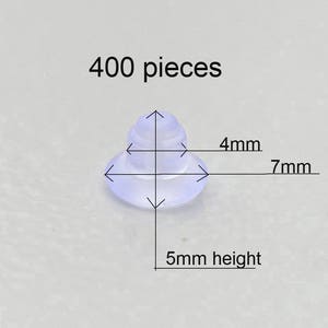 May include: 400 clear plastic furniture feet, each measuring 7 mm in diameter and 5 mm in height. The feet have a 4 mm diameter base.