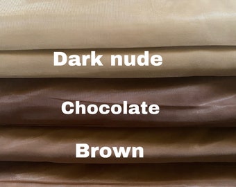 May include: Four swatches of sheer fabric in different shades of brown. The swatches are labeled "Dark nude", "Chocolate", "Brown", and "Caramel Nude".