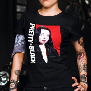 Pins & Bones Women’s Morticia Addams T Shirt Pretty In Black Classic Morticia Addams Witch Spooky Goth Tee