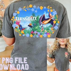 May include: A gray t-shirt with a colorful graphic of a bat and characters from the movie FernGully: The Last Rainforest. The graphic is surrounded by flowers and leaves.