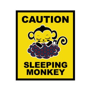 May include: Yellow caution sign with black border and text "CAUTION SLEEPING MONKEY". A cartoon monkey is sleeping on a blue and red cloud with a donut pattern.