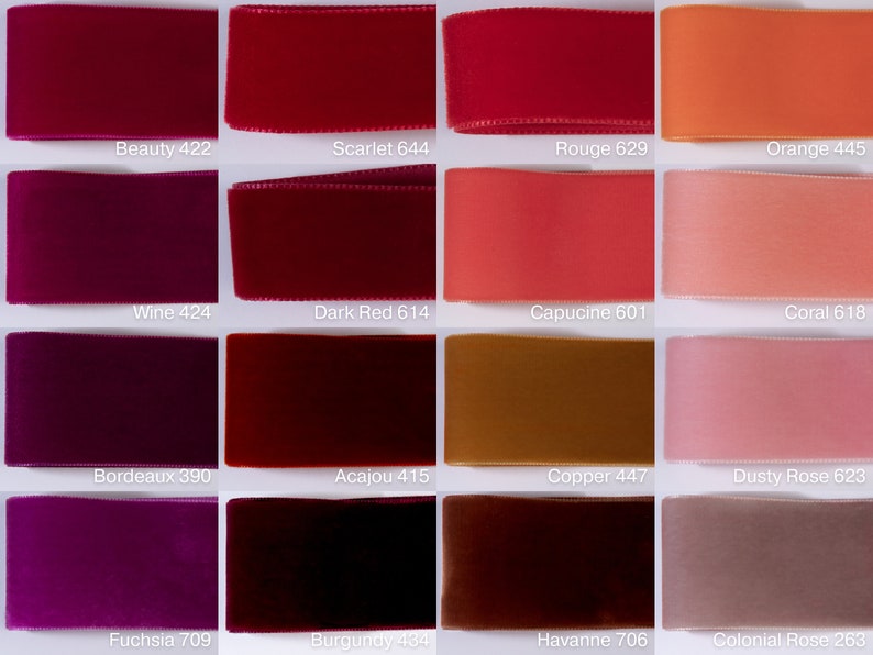 May include: A grid of sixteen velvet ribbons in various shades of red, pink, orange, and brown. Each ribbon is labeled with a color name and number, including Beauty 422, Scarlet 644, Rouge 629, Orange 445, Wine 424, Dark Red 614, Capucine 601, Coral 618, Bordeaux 390, Acajou 415, Copper 447, Dusty Rose 623, Fuchsia 709, Burgundy 434, Havanne 706, and Colonial Rose 263.