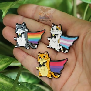 Cats with LGTBIQ+ flags. Enamel pins.