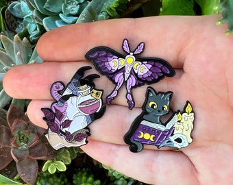 Witch Enamel Pins. Hand with potion and snake, lunar moth and cat with spells. Moon, skull, candles, plants… Special for wicca and Halloween