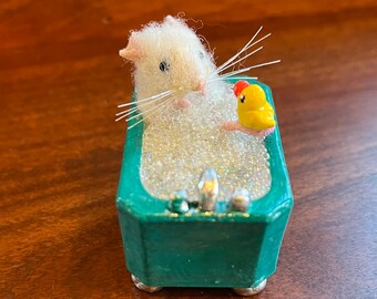 Tiny mouse with her rubber ducky taking a bubble bath!