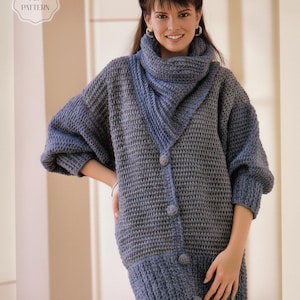 May include: A blue and grey crochet sweater with a matching scarf and buttons. The sweater has a textured pattern and a high collar. The image includes the text "CROCHET PDF PATTERN".