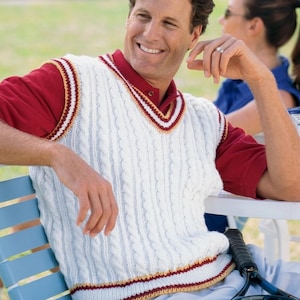 May include: A white cable-knit sweater vest featuring a V-neckline with maroon and gold striped trim. The sleeveless garment has a ribbed hem with matching maroon and gold stripes. The text PDF File Pattern is visible in the upper left corner.