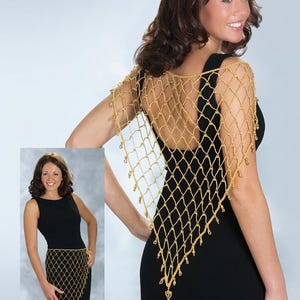 May include: A gold-colored crocheted net shawl featuring a diamond-shaped pattern with small dangling beads at the intersections. The accessory is shown draped over the shoulders and also worn around the waist over a sleeveless black dress.