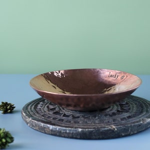 Medium Sized Solid Copper Bowl with 'Lucky #7' Stamped on the inside rim.