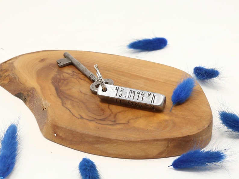 polished Square barkeyring with coordinates hand stamped on one side. 6th anniversary gift