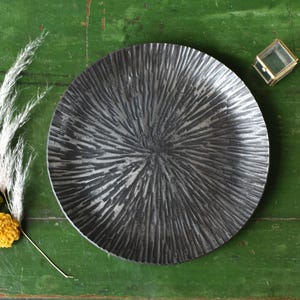 6th Anniversary hand crafted Iron dish with starburst pattern.