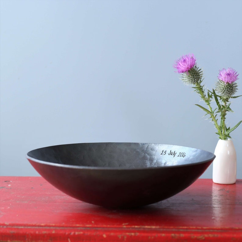large deep hammered iron bowl made by blacksmith