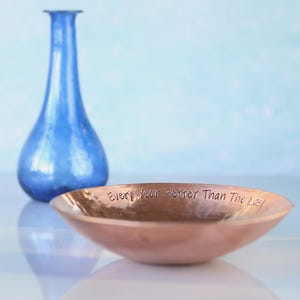 Medium Copper bowl with a hand stamped message around the rim 'Every Year Better Than The Last'. 7th Anniversary gift