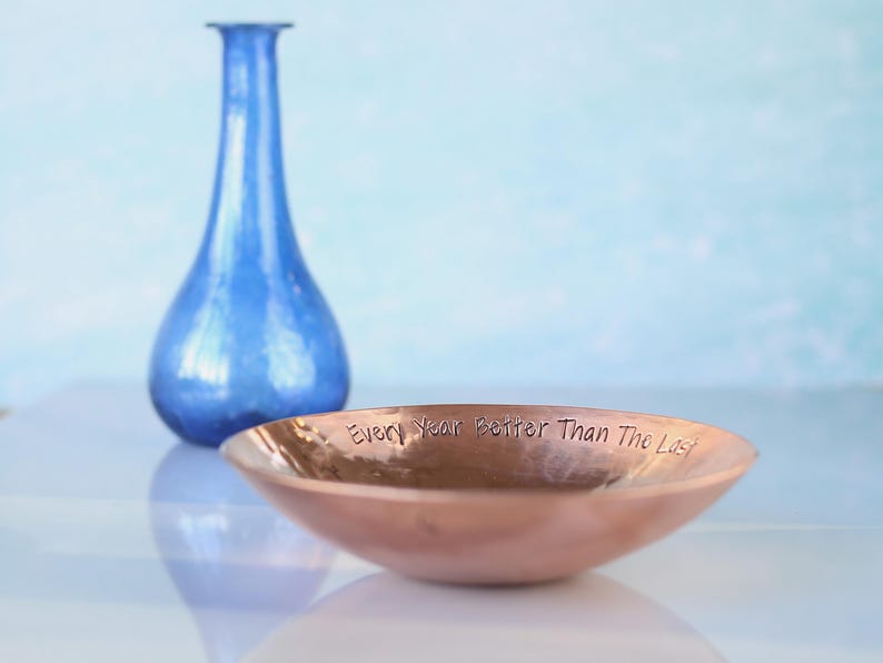 Medium Copper bowl with a hand stamped message around the rim 'Every Year Better Than The Last'. 7th Anniversary gift