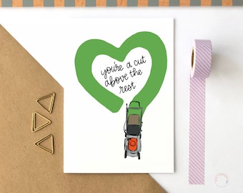 Op de afbeelding: Een witte kaart met een groen hart en een grasmaaier. Het hart heeft de tekst "you're a cut above the rest" erin.