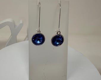 TIA- Swarovski Rivioli 12mm Dangle Earrings in Silver Setting, Oval Earwires, in Sapphire Blue