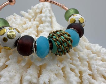 Earthy Elegance: Copper Bangle with Artisan Glass Beads