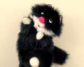 Puppet Black Fluffy Cat for children. Soft, pleasant and cheerful toy cat for children's performances, games and educational activities.